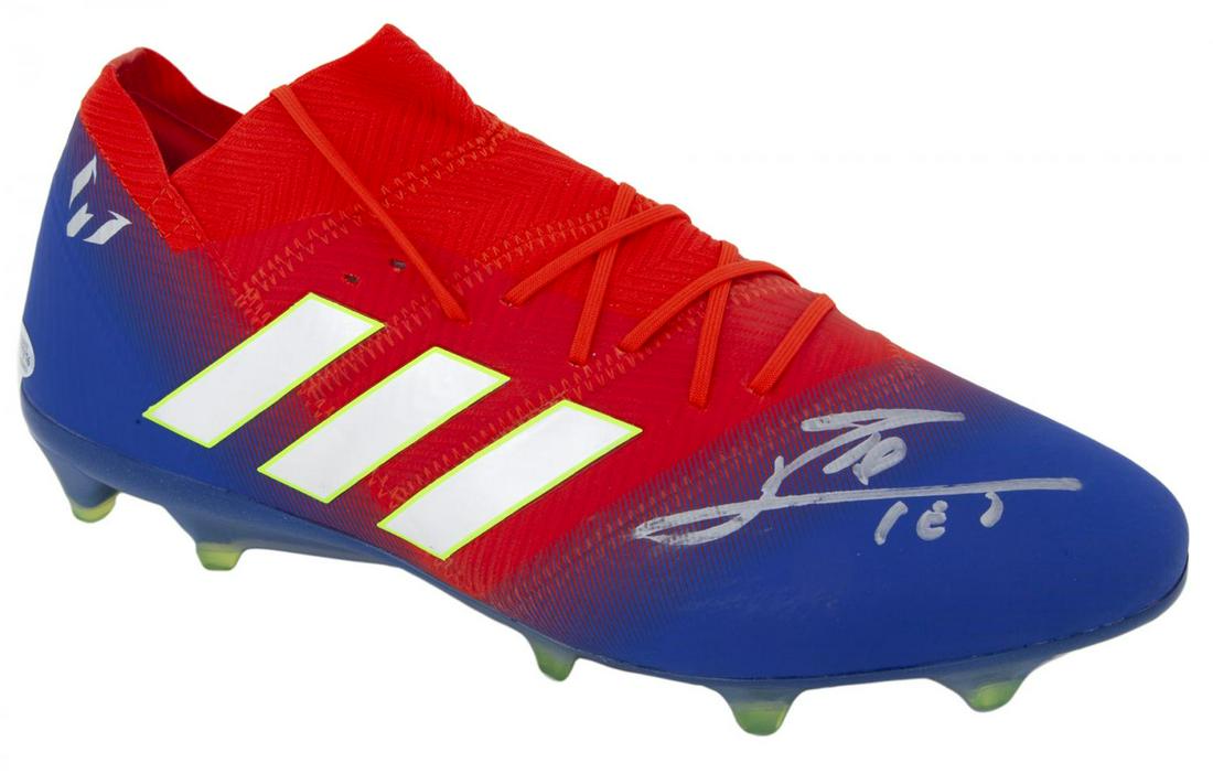 LIONEL MESSI SIGNED BOOT: An Adidas brand Nemeziz 18.3 boot signed by Lionel Messi to the exterior in silver marker. The boot features “Messi” to the inner exterior. The boot was signed during a private signing ses