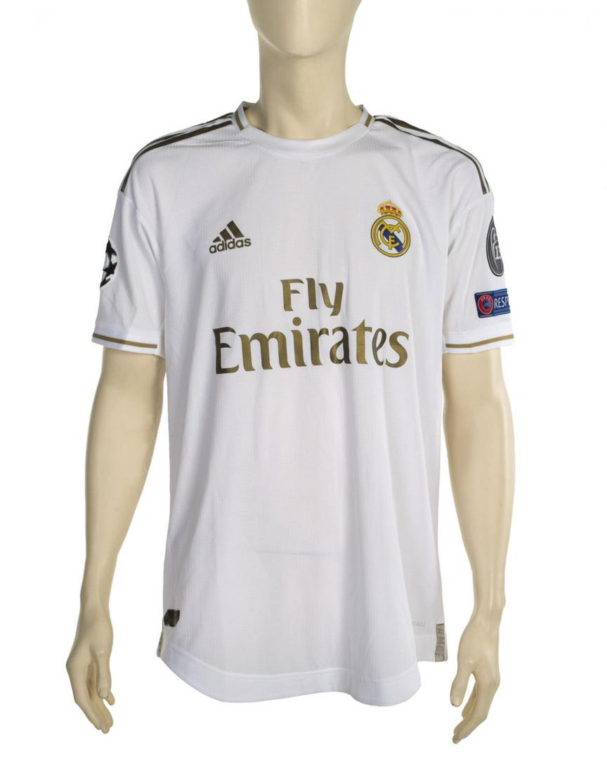 VINICIUS JR. 2019-2020 GAME WORN REAL MADRID JERSEY: An Adidas brand Real Madrid jersey game worn by Vinicius Jr. during the 2019-2020 UEFA Champions League season. Size M. Sports