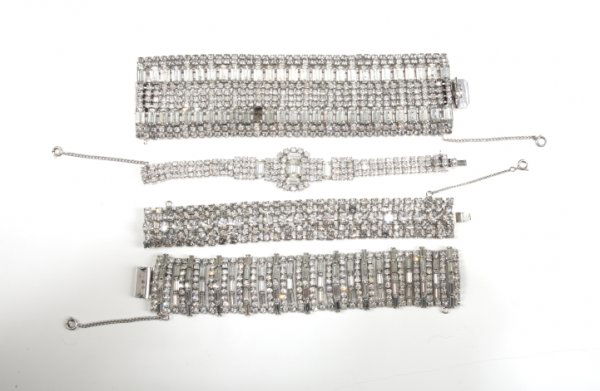 MICHAEL JACKSON RHINESTONE BRACELETS: Group of four vintage rhinestone chain bracelets of varying size each featuring safety chain, and pinch snap closure. One bracelet missing half of closure. Dimensions: 7 1/4 inches