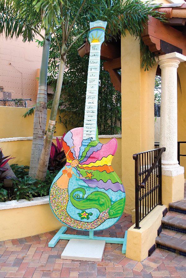 The Water's Gift by Shari Sherman: Acrylic paint, jewel embellishments and varnish on fiberglass. Shari Sherman is a Hawaiian-born artist who uses brightly-colored acrylics to create whimsical "happy art." She is primarily self-taught,