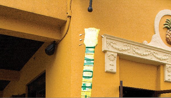 Orlando's Musical Voice-Trument by Elsie Castaneda: Maps of Orlando, picture of leaders, pictures of Orlando trademark, collage glue, acrylic paints, gold and silver leaf on fiberglass. Born in Miami, Florida to famous 1950's Cuban musician Leo Castane