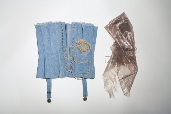 FAYE RESNICK AND JENNIFER MIRIAM "PLAYBOY" ITEMS: Denim bustier worn by Jennifer Miriam in her Playboy centerfold and sheer silver Helmut Lang shirt worn by cover model Faye Resnick. Both items found in the March 1997 issue of Playboy magazine. Resni