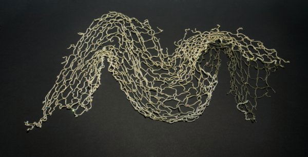 JAMIE BERGMAN PHOTOGRAPH ACCESSORY FROM PLAYBOY: Netting wrap with gem accents worn by Jaime Bergman in her July 2000 Playboy pictorial. At this time Bergman was starring in the television program "Son of the Beach," a Baywatch parody that ran from