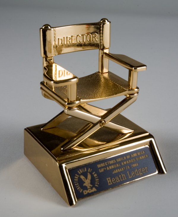 HEATH LEDGER DIRECTOR'S GUILD OF AMERICA STATUETTE: Gold tone director’s chair statuette from the Directors Guild of America Annual Awards Dinner from 2005. Ledger was a presenter at the event where "Brokeback Mountain" (Alberta Film Entertainment, 2