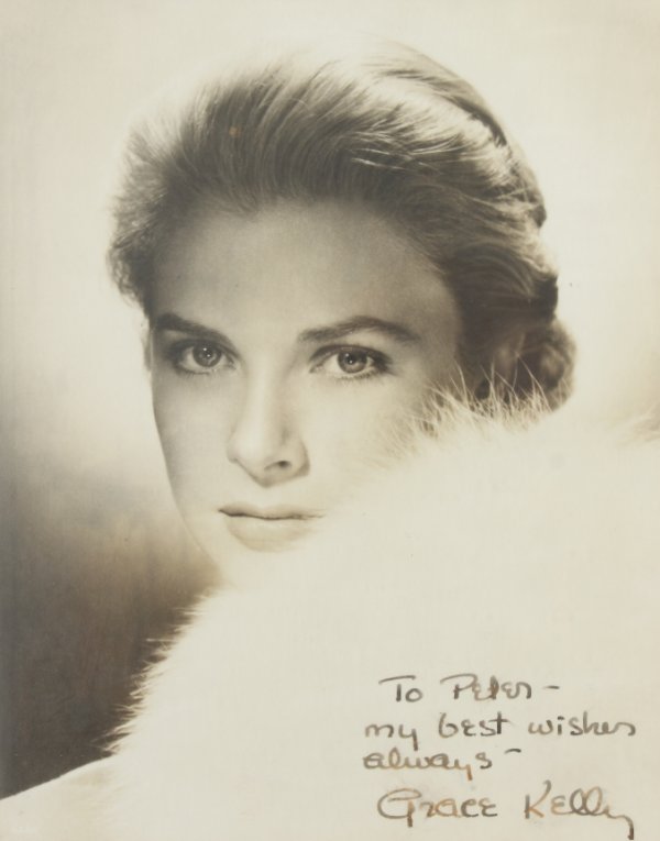 GRACE KELLY SIGNED PHOTOGRAPH: Vintage original black and white photograph inscribed to Peter Leonardi by Grace Kelly. Inscription reads, "To Peter - My best wishes always - Grace Kelly." 13 3/4 by 11 1/4 inches, framed PROVENANCE 