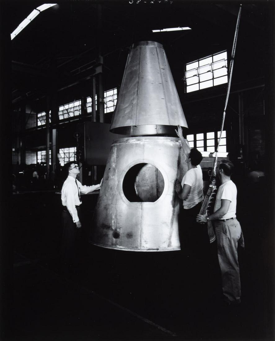 NASA MERCURY CAPSULE DEVELOPMENT PHOTOGRAPHS: A binder containing forty-five 8-by-10-inch photographs documenting the development process of the Mercury space capsule design, including images of wind-tunnel tests on models and drop tests of full 
