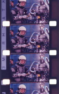 NASA SPACE SUIT AND ROCKET ENGINE FILM FOOTAGE: Four reels of 16mm film containing footage of unidentified crew members testing the maneuverability of various space and flight suits while performing maintenance on rocket engines (RL10 etc.)