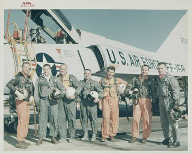 NASA MERCURY ASTRONAUT CREW PHOTOGRAPH: An original NASA color photograph featuring the Mercury program astronaut crew, including Scott Carpenter, Gordon Cooper, John Glenn, Gus Grissom, Wally Schirra, Alan Shepard, and Deke Slayton. The