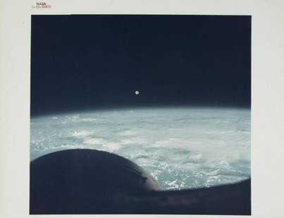 NASA GEMINI 7 MOON FROM EARTH ORBIT PHOTOGRAPH: An original NASA color photograph featuring the Moon taken from Gemini 7 while in orbit above the Earth. The photograph bears the red number S-65-63872 and is marked on the verso A Kodak Paper. 8 by