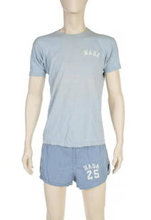 NASA APOLLO 7 FLOWN DONN EISELE T-SHIRT AND SHORTS: A light blue Champion brand T-shirt and matching pair of running shorts both bearing the name NASA. The athletic ensemble was reportedly worn by astronaut Don Eisele during his 11-day flight as