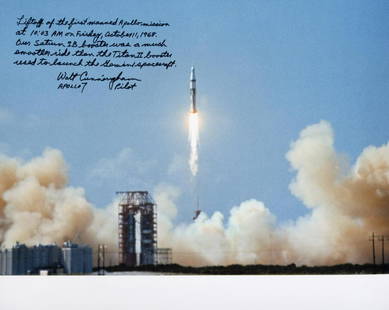 WALT CUNNINGHAM SIGNED APOLLO 7 LIFTOFF PHOTOGRAPH: A superb large-format color photograph showing the liftoff of the Apollo 7, signed by NASA astronaut and Apollo 7 pilot, Walt Cunningham, and inscribed "Liftoff of the first manned Apollo mission at