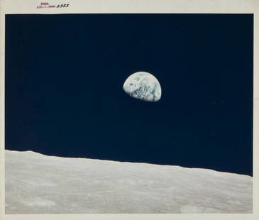 NASA APOLLO 8 EARTHRISE PHOTOGRAPH: An original NASA color photograph featuring an image of the Earth rising, taken from Apollo 8. The photograph bears the red number AS8-16-2383, is marked on the verso A Kodak Paper, and is stamped on