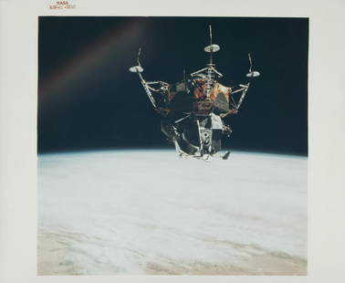 NASA APOLLO 9 LUNAR MODULE IN EARTH ORBIT PHOTOGRAPH: An original NASA color photograph featuring the Apollo 9 lunar module in orbit above the Earth. The photograph bears the red number AS9-21-3212 and is marked on the verso A Kodak Paper. 8 by 10