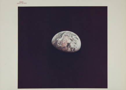 NASA APOLLO 10 EARTH PHOTOGRAPH: An original NASA color photograph featuring the Earth as seen from the window of Apollo 10. The photograph bears the red number AS10-34-5026, is marked on the verso A Kodak Paper, and is stamped in