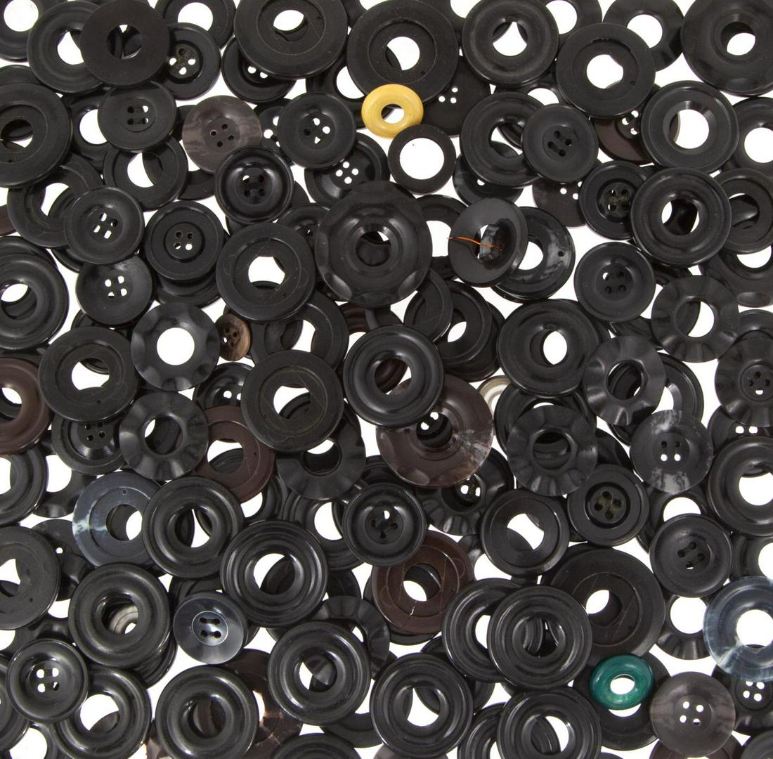 SOVIET KGB SPY HIDDEN CAMERA COAT BUTTONS: A bag of Soviet KGB spy coat buttons, including numerous examples which have been modified with screw threding so they can be used with hidden camera concealment devices. 11 1/2 by 6 1/2 by 1 inches (