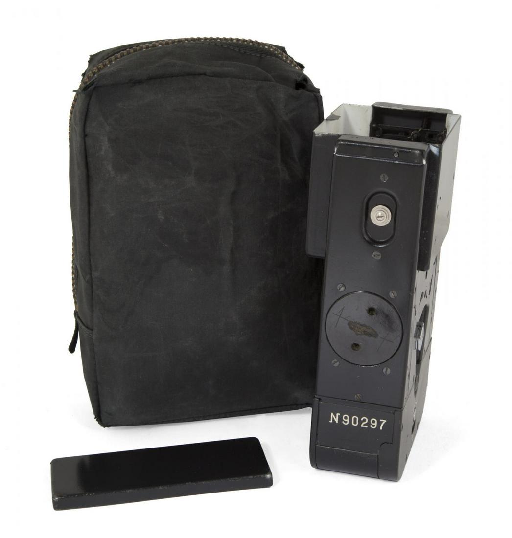SOVIET KGB SPY ZASLON DOCUMENT COPIER: A Soviet KGB spy "Zaslon" C-313 copying device for reproducing classified documents. Includes original instruction manual, lens cover, and carry pouch. 5 1/2 by 3 3/8 by 2 inches