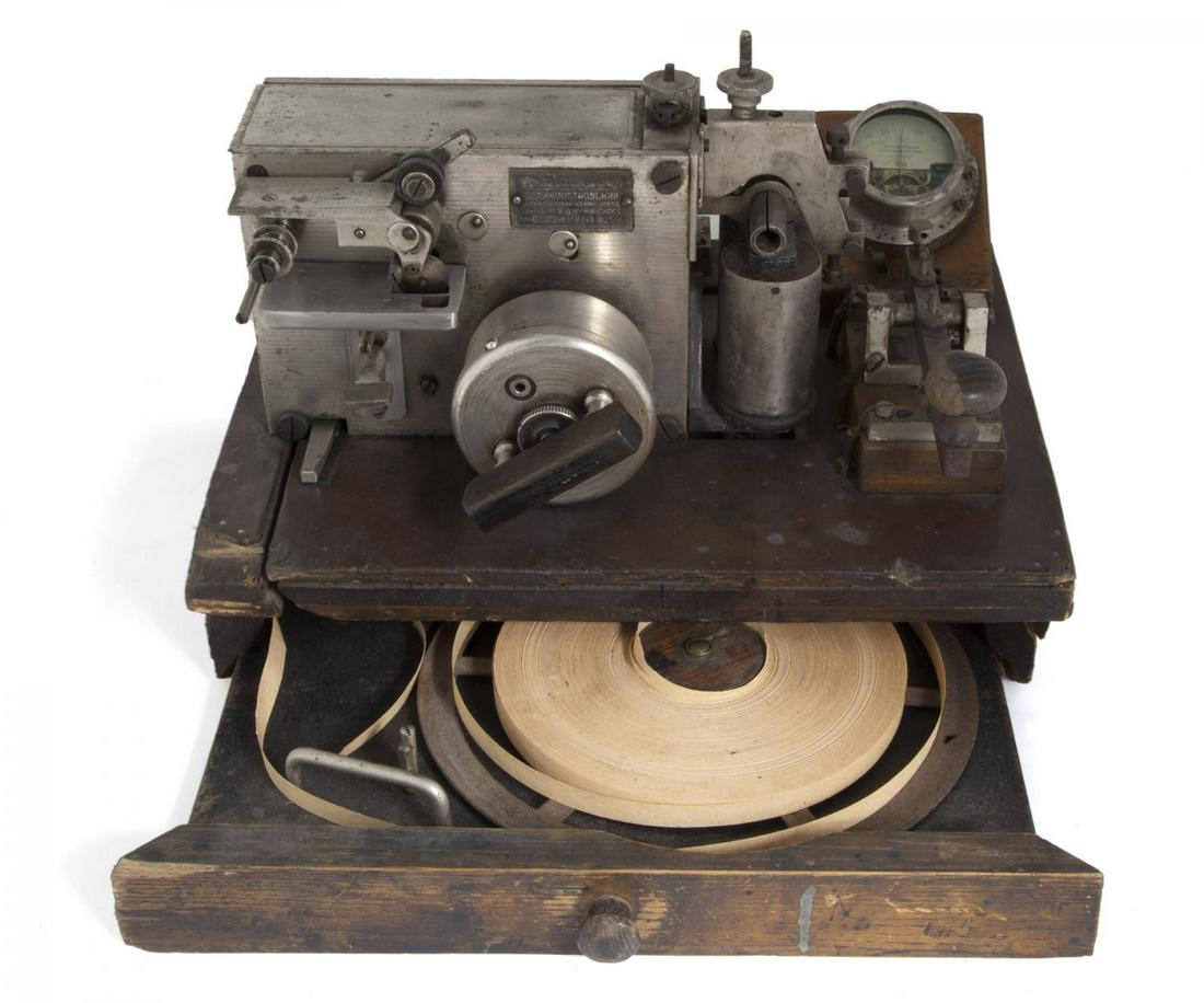 SOVIET ANTIQUE TELEGRAPH MACHINE: An antique Soviet telegraph machine, together with an antique German, W. Gurlt model Voltometer. Serial Number: 17271 13 1/4 by 10 by 9 inches