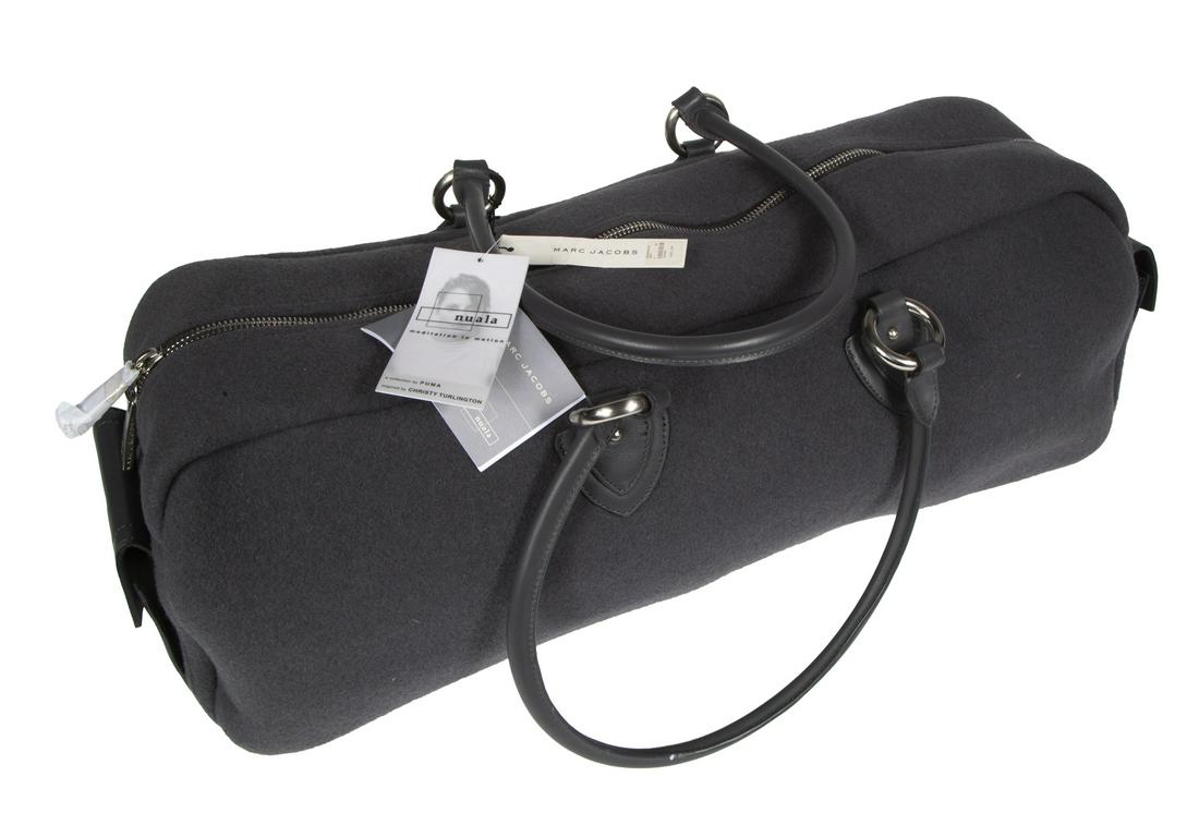 MARC JACOBS FOR PUMA CHRISTY YOGA BAG: A grey canvas and leather Nuala yoga mat bag in canvas with leather accents, designed by Christy Turlington. 6 by 24 by 9 inches Fine Art