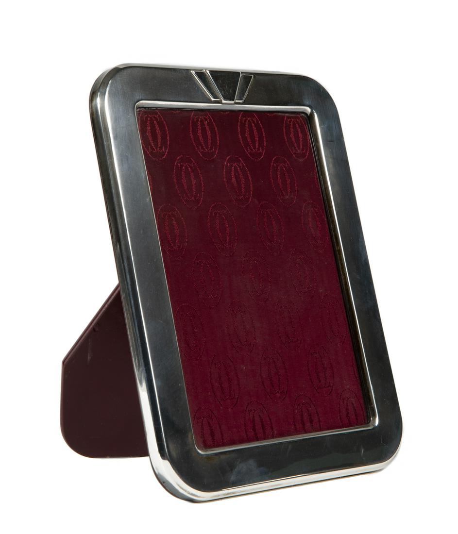 CARTIER STERLING SILVER PICTURE FRAME: A modern sterling and wood picture frame. Non weighable. 8 3/4 by 6 3/4 inches Fine Art