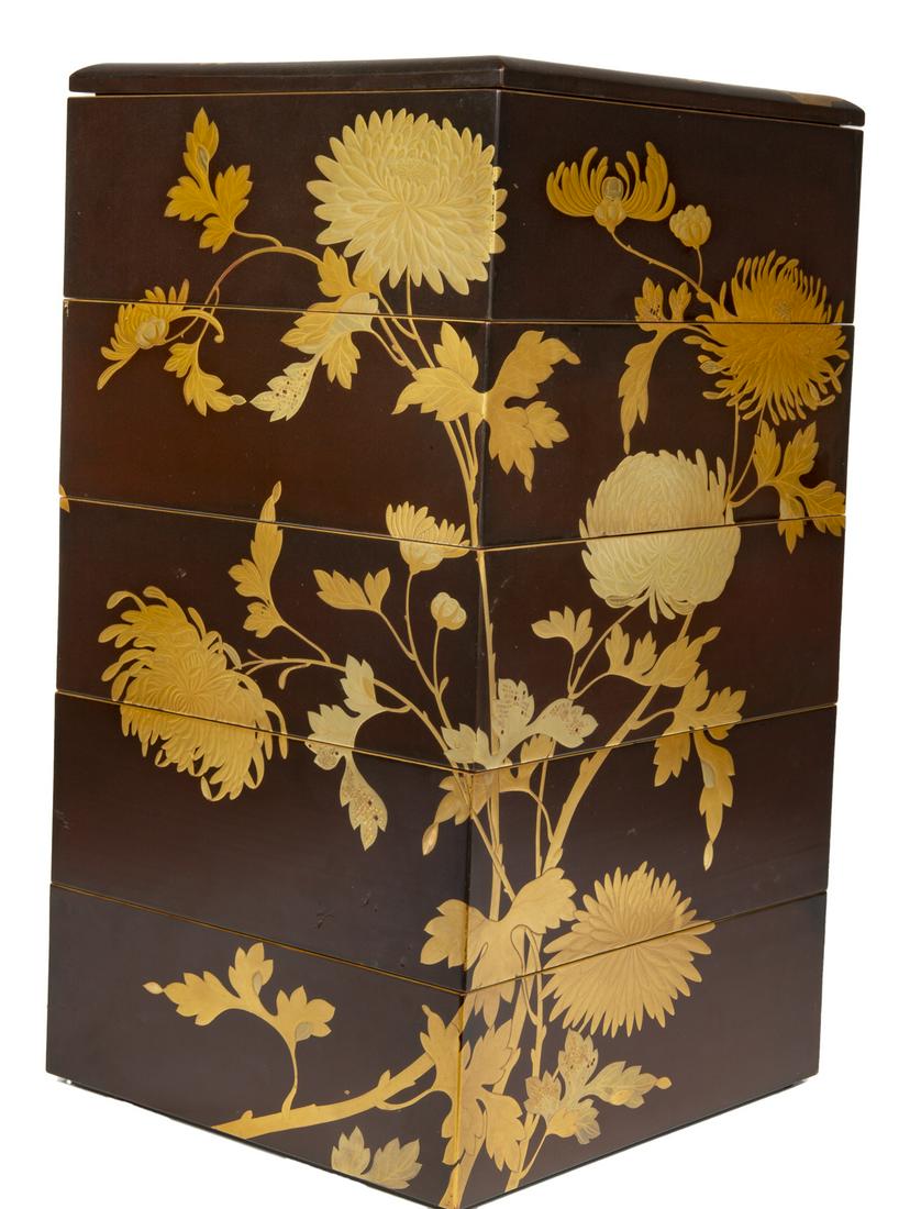 JAPANESE MEIJI PERIOD (1868-1912) FIVE TIER LACQUER JUB: A five tier square box and cover depicting gilt chrysanthemums and foliage, early 20th century. 16 1/2 by 9 1/2 by 9 1/4 inches Fine Art