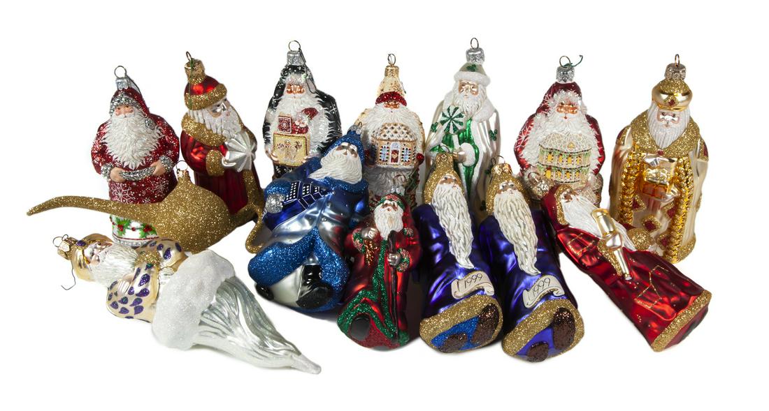 GROUP OF SANTA CLAUS CHRISTMAS ORNAMENTS: A group of handblown and painted glass Santa Claus ornaments with glitter, by Patricia Breen. (One ornament is an Aladdin's Lamp, paired with the Aladdin Santa). 14 pieces total. Sizes vary Fine Art