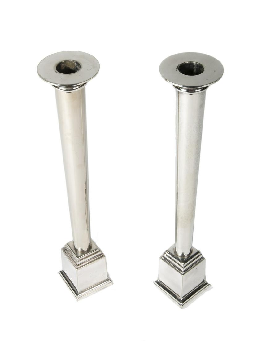 PAIR OF SWID POWELL CANDLESTICKS: A pair of silver plated "Metropolitan" candlesticks designed by Robert A.M. Stern for Swid Powell, 1984. Height, 12 inches Fine Art
