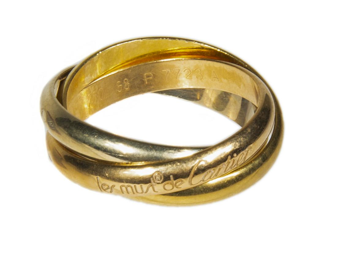 LES MUST DE CARTIER TRINITY 18K GOLD RING: A rolling men's Must de Cartier Trinity band with 18K rose, yellow and white gold in original presentation box. Size 7 1/4, 9.8 grams. Fine Art