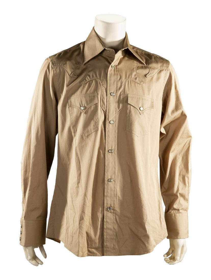 SEVEN BLACK, BROWN, AND TAN DESIGNER SHIRTS: A group of seven silk of cotton luxury brand shirts, including: a black Gucci ruffle tuxedo shirt, size 43/17; a Dior shirt, size 42; a brown and black striped Marc Jacobs shirt, size 54; a brown Prad
