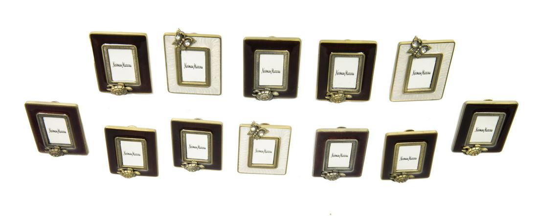 JAY STRONGWATER MINIATURE ENAMELED FRAMES: A group of nine brown with turtle and three cream with butterfly colored enameled miniature picture frames, some with Swarovski crystals, retailed by Neiman Marcus. 2 1/4 by 1 3/4 inches Fine Art