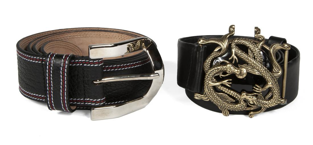 TWO BLACK DESIGNER BELTS: A black leather Alexander McQueen belt with a bronze dragon buckle, size 48; together with a black leather Dole & Gabbana belt with red and white stitching, size 100/40. Fine Art