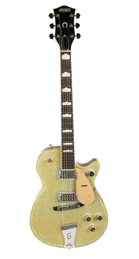GRETSCH G6129D SILVER JET GUITAR: A Gretsch G6129D Silver Jet electric guitar, serial number 906129 487, two FilterÕTron humbucking pickups, chrome hardware, hump block inlays and no case. Rock 'N' Roll