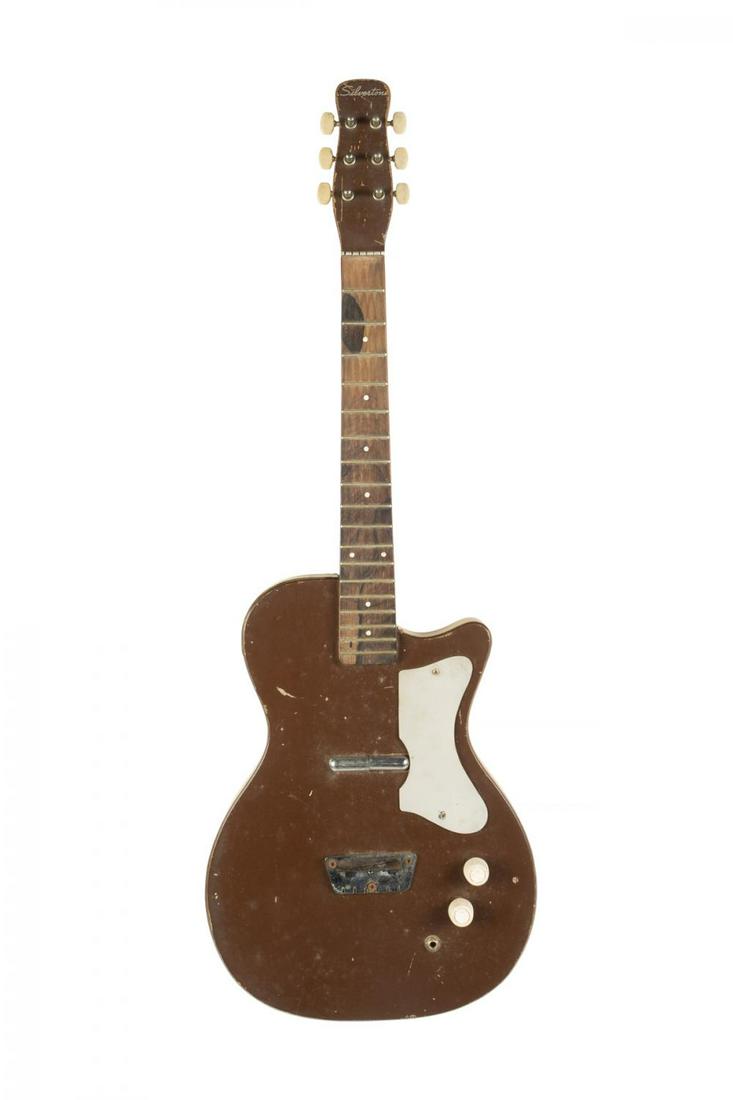 TOM PETTY SILVERTONE DANELECTRO GUITAR GIFTED TO GEORGE: A Silvertone Danelectro guitar owned by Tom Petty who gifted it to George Harrison and George then gifted to Fred Gretsch (in 1987) to use as a prototype for the Traveling Wilburys guitar line. Includ