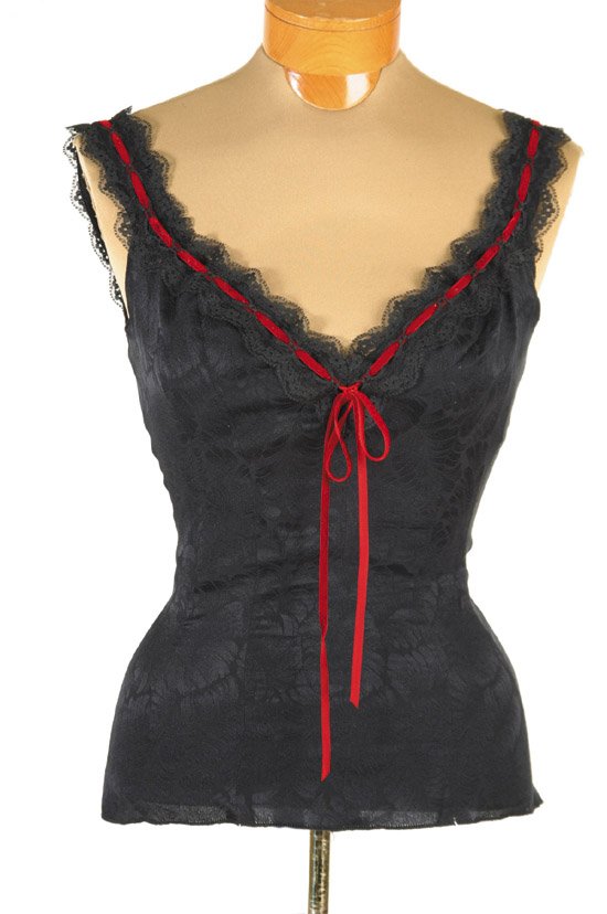 Elizabeth Taylor Lingerie from Poker Alice: This lingerie top was for Elizabeth Taylor by Nolan Miller for the television movie "Poker Alice". The top is made of a delicate black patterned satin with black lace straps. The neckline comes to a l