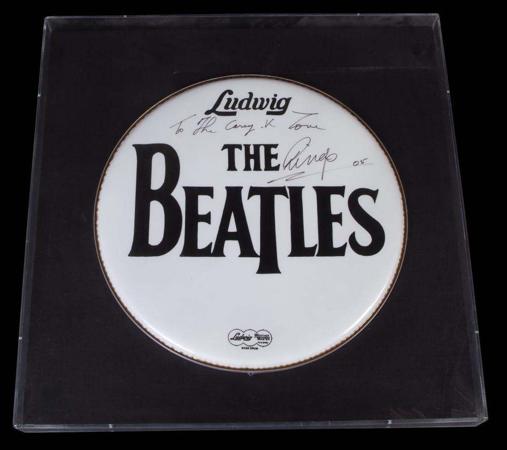 THE BEATLES: RINGO STARR SIGNED DRUMHEAD: A framed Ludwig "The Beatles" labeled bass drum head, signed and inscribed to Casey Kasem from Ringo Starr. The message, handwritten in black marker, reads: "To The Casey K. - Love Ringo, 05." Framed,