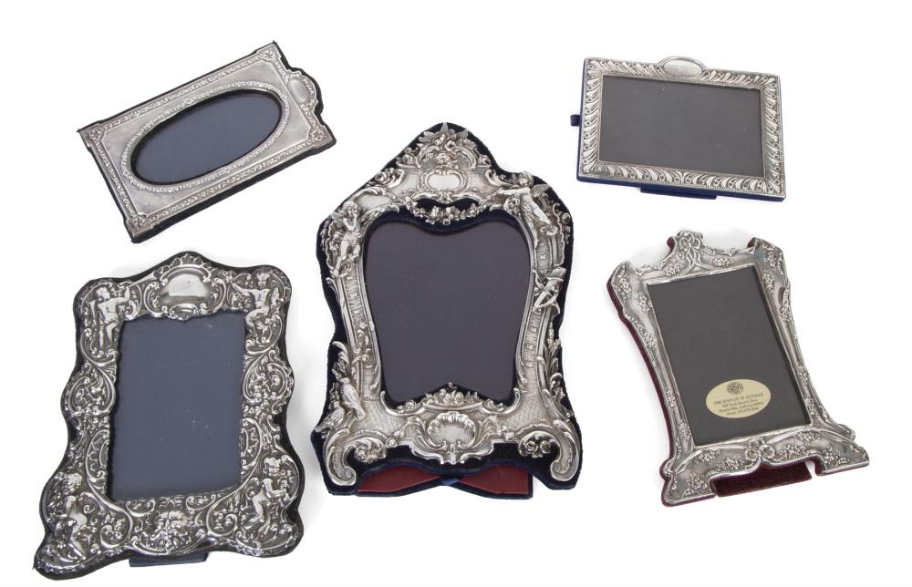 JEAN AND CASEY KASEM FIVE STERLING PICTURE FRAMES: A group of five sterling frames, most by British makers, circa 1987-88. Largest, 13 x 8.5 inches PROVENANCE From The Collection of Jean and Casey Kasem