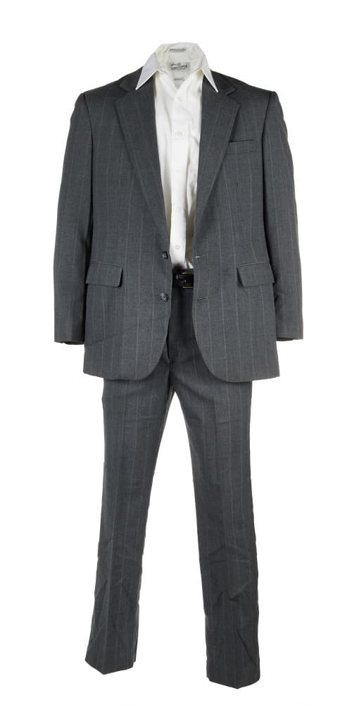 A FAMILY THING | ROBERT DUVALL "EARL PILCHER JR." SUIT: A suit as seen worn by Robert Duvall as "Earl Pilcher Jr." in the comedy/drama A Family Thing (United Artists, 1996). The ensemble includes a white, cotton-blend button-down shirt, labeled "Sears Roeb