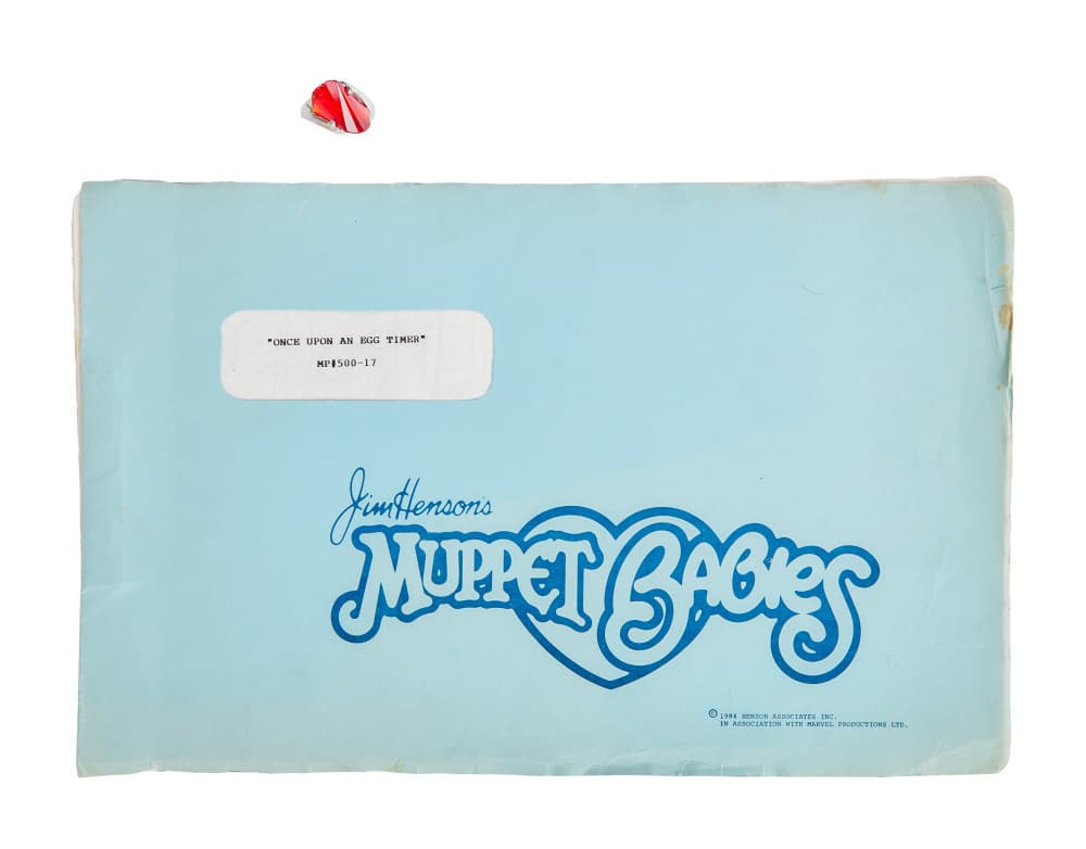 MUPPET BABIES | "ONCE UPON AN EGG TIMER" STORYBOARDS AND MISS PIGGY COSTUME RING PROP: Original storyboard copies for an episode titled "Once Upon an Egg Timer" from Muppet Babies (Marvel Productions, 1985) and an original costume ring prop for Miss Piggy from The Muppets (The Walt Disn
