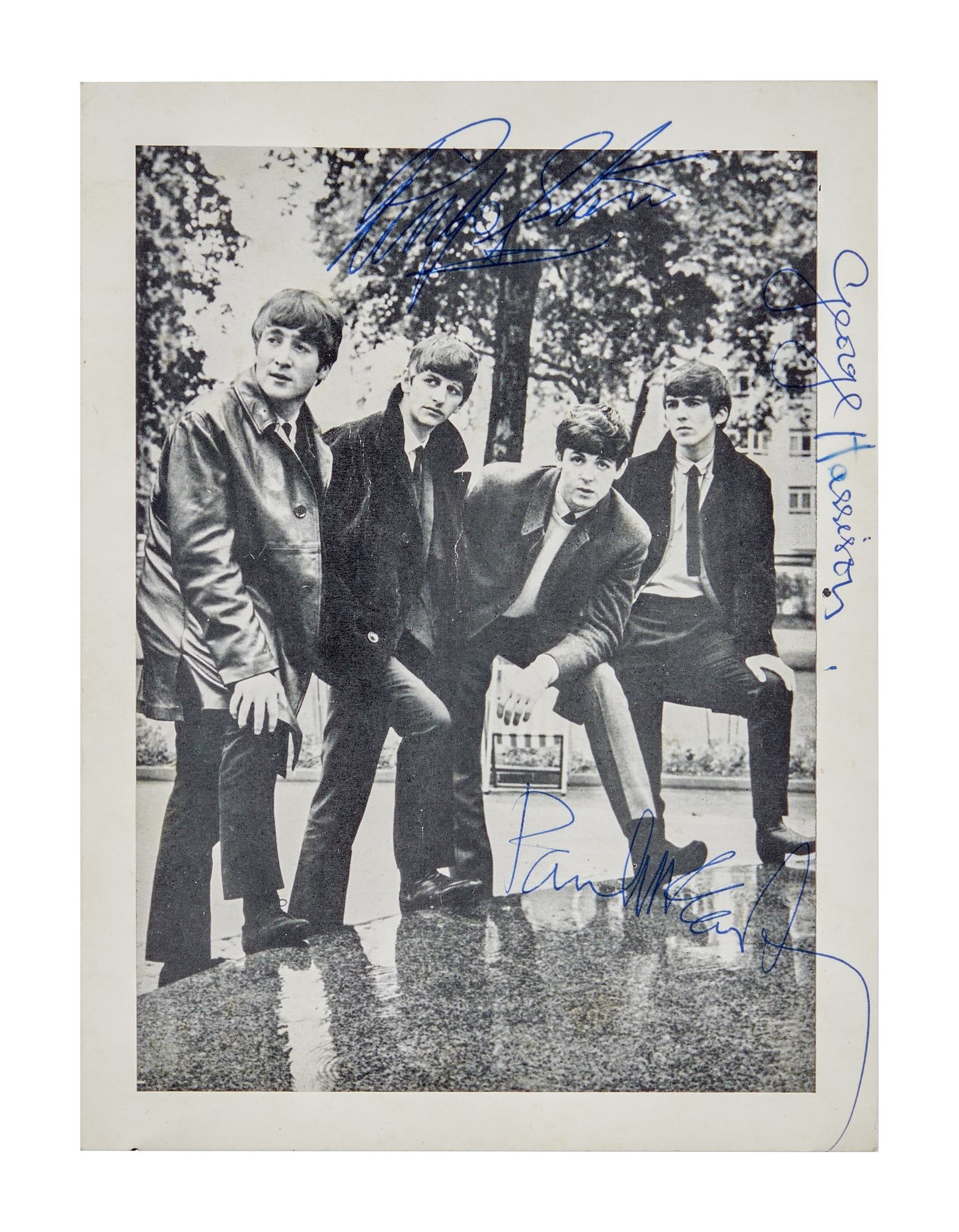 THE BEATLES | PAUL MCCARTNEY, GEORGE HARRISON, AND RINGO STARR SIGNED 1963 SOUVENIR PHOTO: A black and white souvenir photograph signed by Paul McCartney, George Harrison, and Ringo Starr while backstage at the Winter Gardens in Bournemouth, England on November 16, 1963. The photo originall