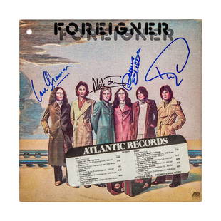 FOREIGNER | SIGNED SELF-TITLED RECORD ALBUM SLEEVE: A record album sleeve for Foreigner's self-titled 1977 album, signed by Lou Gramm, Mick Jones, Dennis Elliott, and Ian McDonald in blue and black marker. Note: record is not included. Dimens