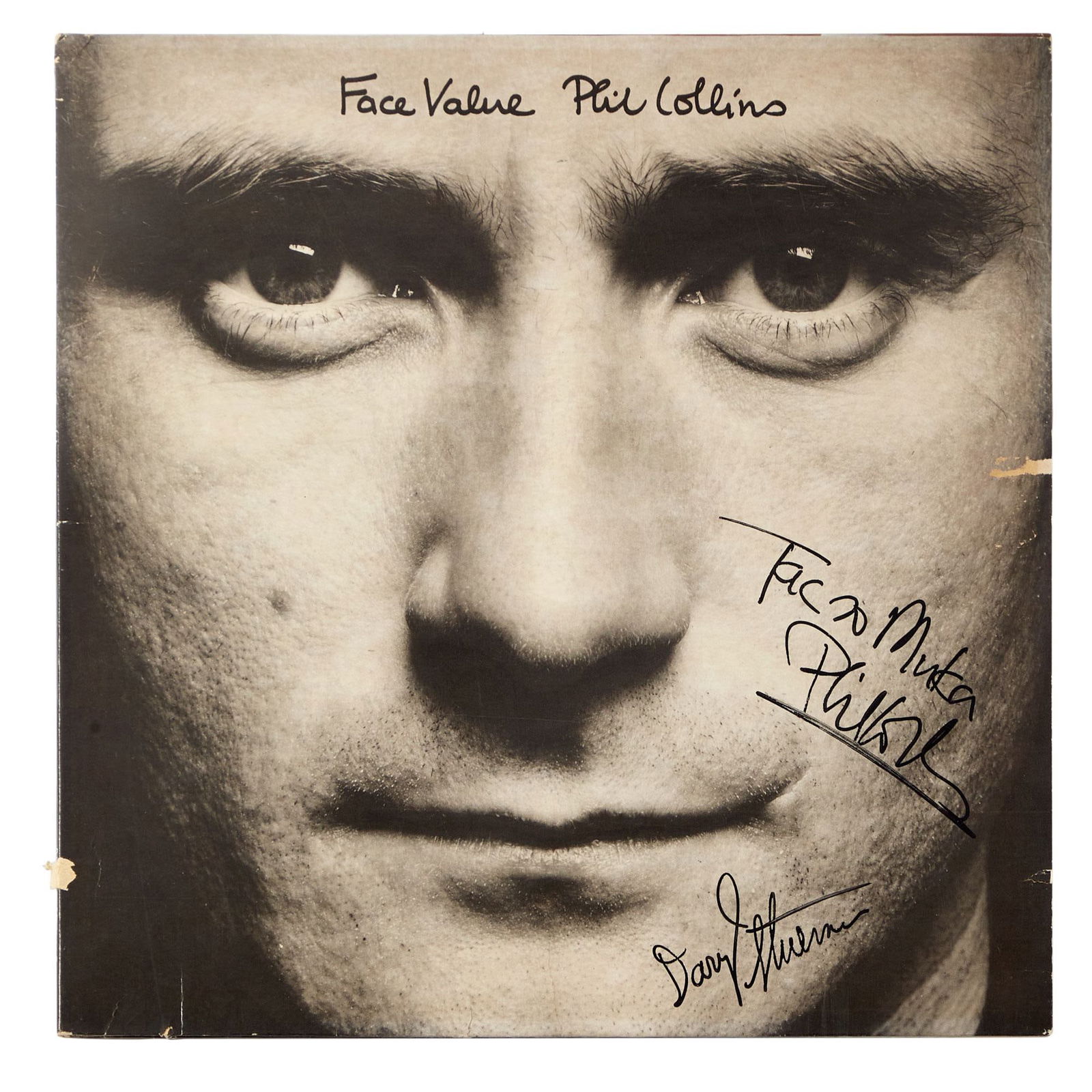PHIL COLLINS | SIGNED "FACE VALUE" RECORD ALBUM SLEEVE: A Face Value record album sleeve signed by Phil Collins and guitarist Daryl Stuermer. Note: record is not included. Dimensions: 12.5 x 12.5 inches COA / LOA: None