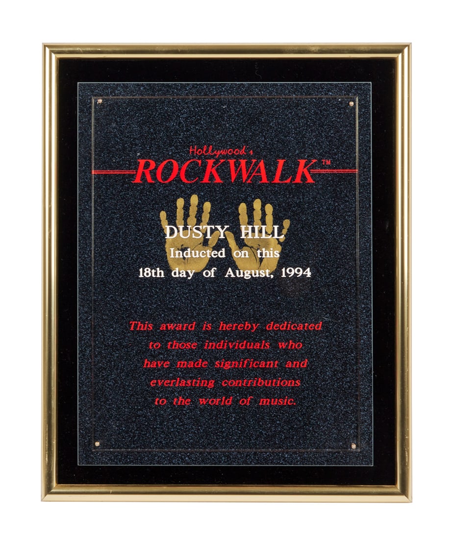 ZZ TOP | DUSTY HILL HOLLYWOOD ROCK WALK PLAQUE: A presentation plaque commemorating Dusty Hill's induction to the Hollywood Rock Walk on August 18, 1994. Dimensions: 15 1/2 by 12 1/2 inches PROVENANCE From The Estate of Dusty Hill