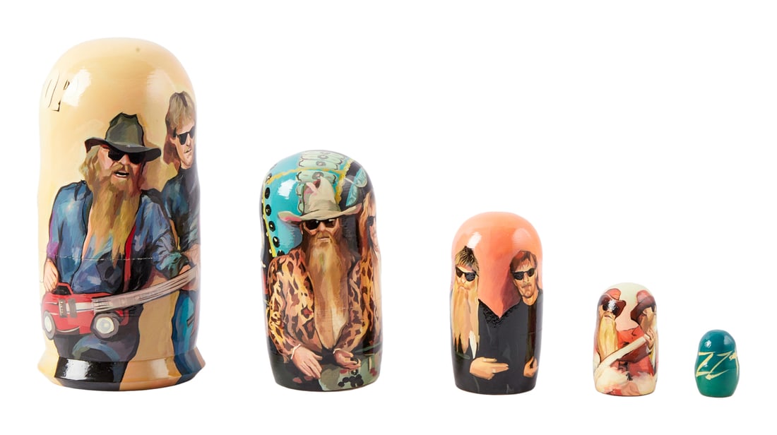 ZZ TOP | DUSTY HILL RUSSIAN NESTING DOLLS: A set of five Russian nesting dolls with detailed painted portraits of the band, the smallest painted simply "ZZ Top." Dimensions: Tallest 7 inches PROVENANCE From The Estate of Dusty Hill