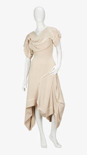 Vivienne Westwood | Spring 2003 Champagne Silk Gown: Lot 37: Vivienne Westwood | Spring 2003 Champagne Silk Gown A Vivienne Westwood Gold Label silk champagne-colored evening dress cut on the bias with a romantic handkerchief hem.&nbsp; Vivienne Westwoo