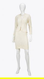 William Travilla | Charlene Tilton "Dallas" Ecru Wedding Suit Ensemble: Lot 59: William Travilla | Charlene Tilton "Dallas" Ecru Wedding Suit Ensemble A white two-piece wedding skirt suit worn by Charlene Tilton as "Lucy Ewing" in Dallas designed by costume desi