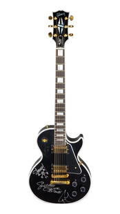 Godsmack | Signed Gibson Les Paul Custom VOS Guitar and Drumhead: A 2020 Gibson Les Paul Custom electric guitar, serial number 200214, finished in Ebony with Gibson's VOS (Vintage Original Spec) finish package, giving the guitar the look and feel of a gently-used