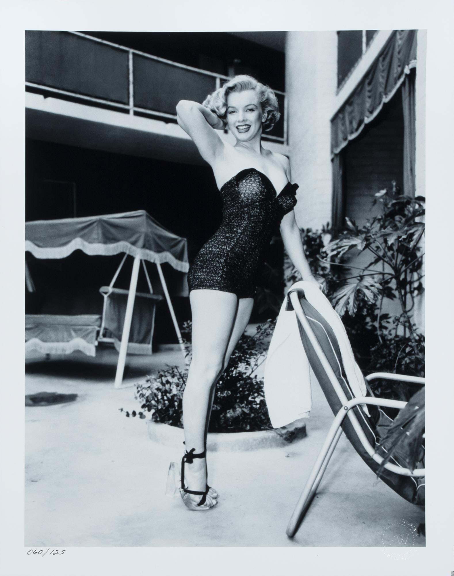 Marilyn Monroe | Frank Worth Limited Edition Oversized Photo: A 2000s-era later print with a semi-gloss finish, depicting Marilyn Monroe in a classic cheesecake pose as she wears a bathing suit and her famous Lucite platform sandals, numbered in the lower left c