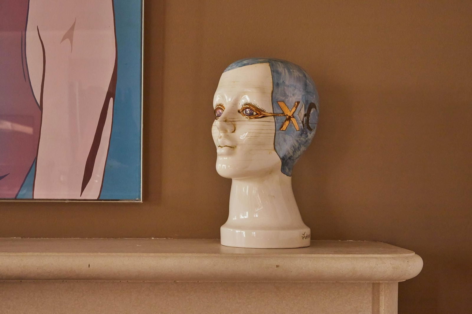 Raquel Welch | Lukman Glasgow Surrealist Ceramic Head Sculpture: A gilt and blue decorated glazed ceramic female head sculpture by artist Lukman Glasgow (American, 1935-1988), in his signature "fantasy realism" style; signed, dated, and numbered "Lukman Glasgow 8-7