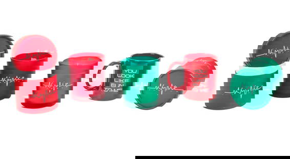 Kylie Minogue, OBE | Candles and Coffee Mug: A group of three items from the singer's London pop-up store; the first is a candle housed in a red canister with a lid, the second is a candle housed in a green canister with a lid, and the third is