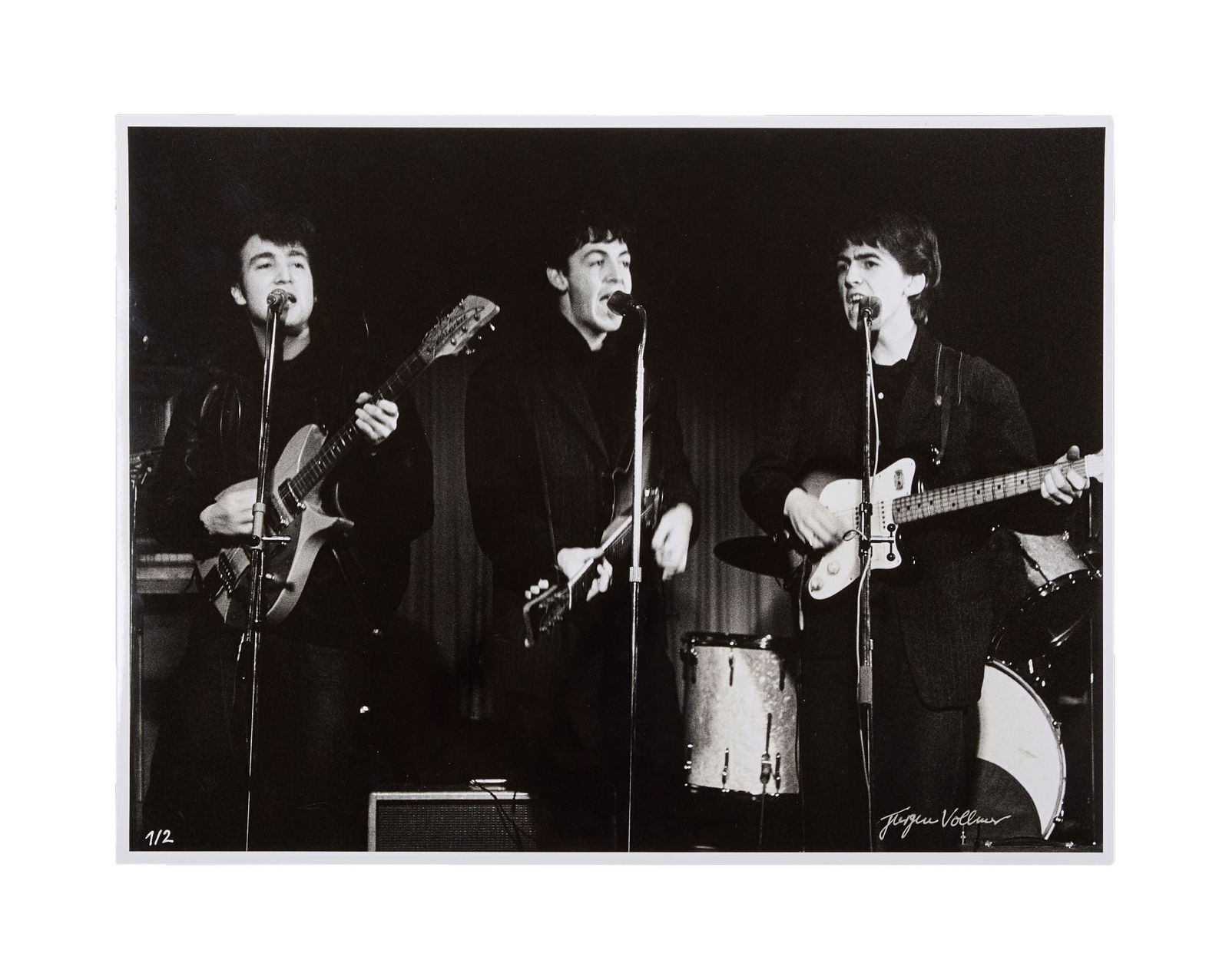 The Beatles | Jurgen Vollmer Signed "Top Ten Club" Hamburg Limited-Edition Photo: A limited-edition photograph of The Beatles: John Lennon, Paul McCartney, and George Harrison playing live on-stage at the Top Ten Club in Hamburgh, Germany. Signed to the lower right by photographer,