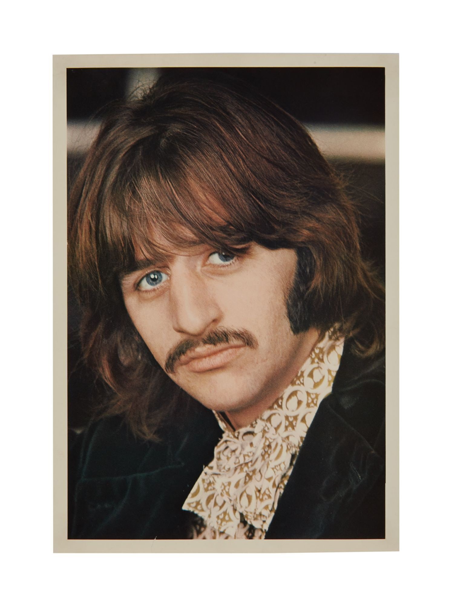 The Julian Lennon Collection | The Beatles "White Album" Ringo Starr Photo Insert Print: A photo print of Ringo Starr, originally included as part of the inserts of The Beatles, "White Album." 11.5 x 8 inches A portion of the sale proceeds from this lot will be donated to The White Feathe